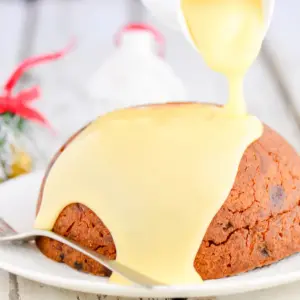 1-Cup Christmas Puddings with Syrup on a Plate