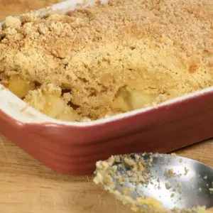Apple Crumble with Spoon on Wooden Table