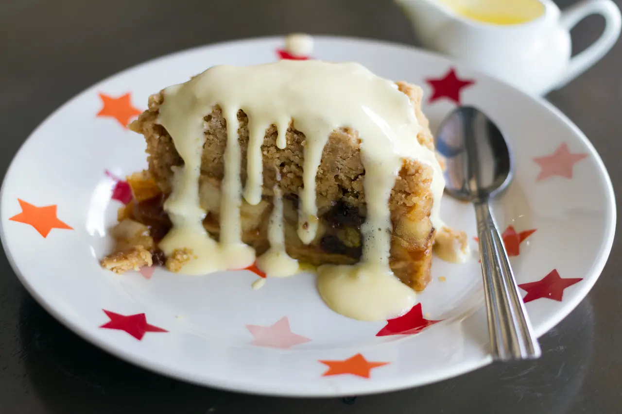 White Plate Filled with Apple Custard Slice With Syrup