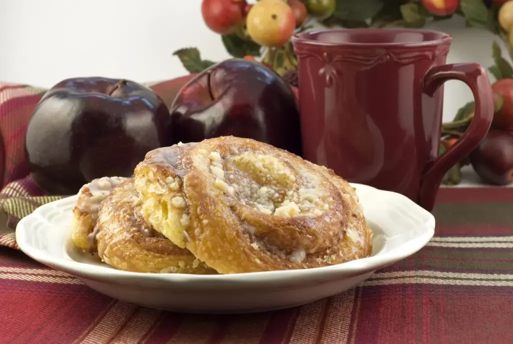 Apple Danish on a Plate with Two Red Apples 