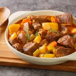 Beef and Guinness Stew on a Wooden Table