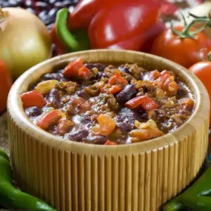 Chilli Con Carne in Wooden Bowl Land Different Vegetables