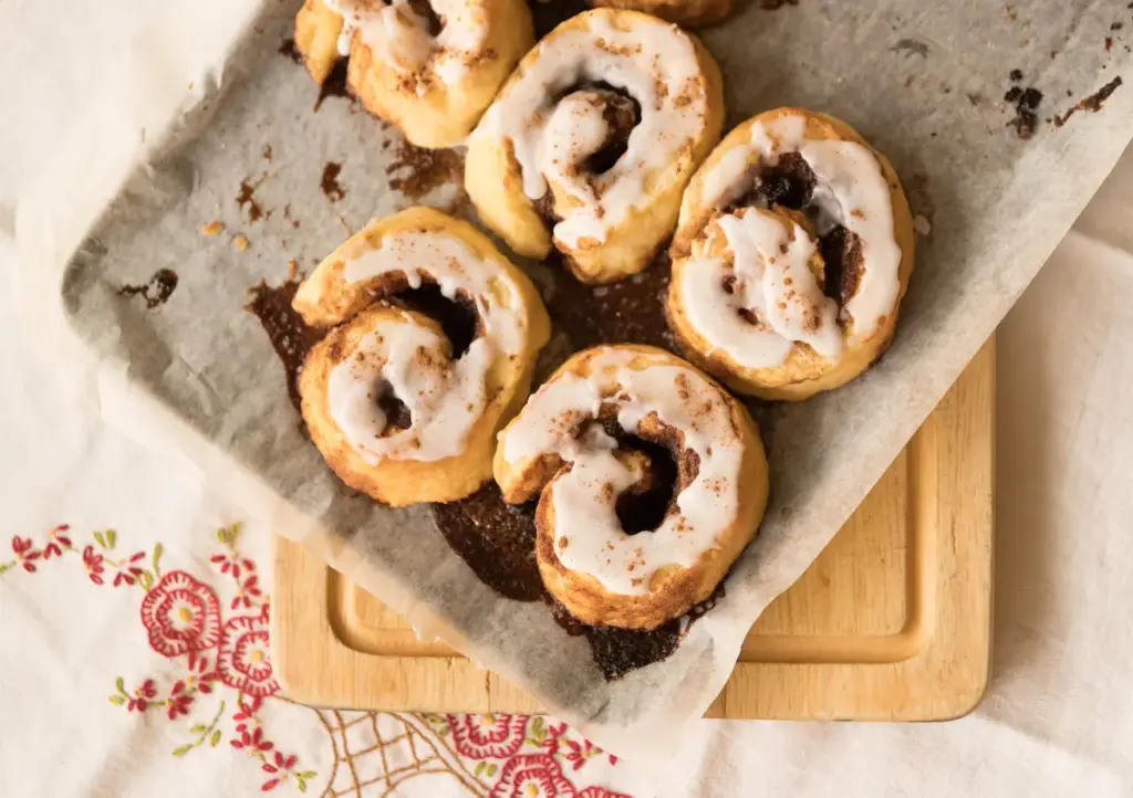 Cinnamon Scrolls with Icing on Baking Tray 