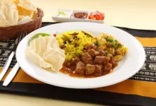 Indian Beef Curry Served with Pappadums.