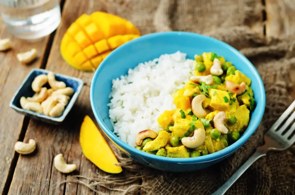 Indian Style Mango Chicken Curry on Blue Bowl