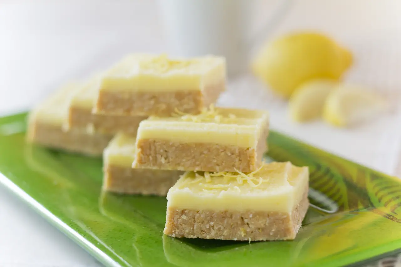 Lemon and Coconut Slice On A Green Plate