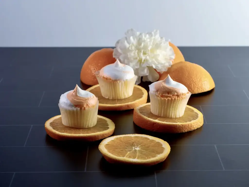 Three Mini Orange Cupcakes  with Orange Fruit