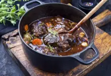 Pressure Cooker Beef Cheeks in Red Wine an Old Rustic Cutting Board