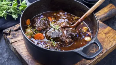 Pressure Cooker Beef Cheeks in Red Wine an Old Rustic Cutting Board