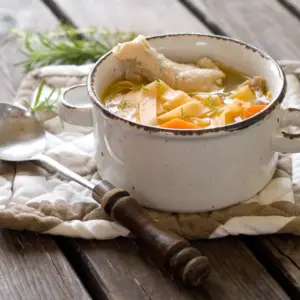 Pressure Cooker Chicken Noodle Soup on a Wooden Table