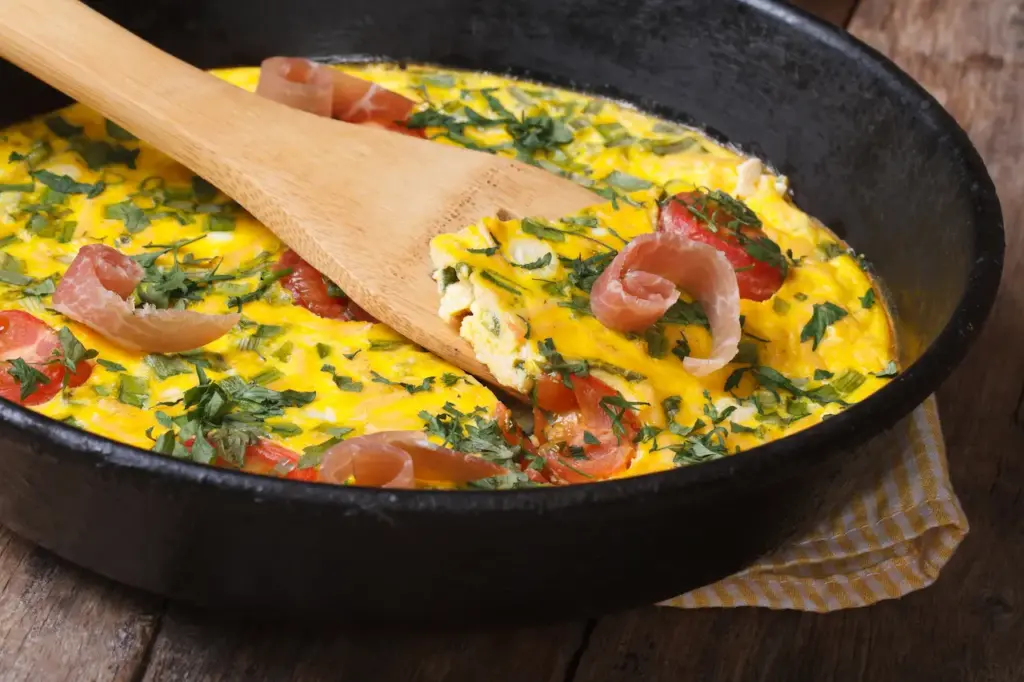 Pumpkin Bacon & Spinach Frittata in the Pan With A Spatula