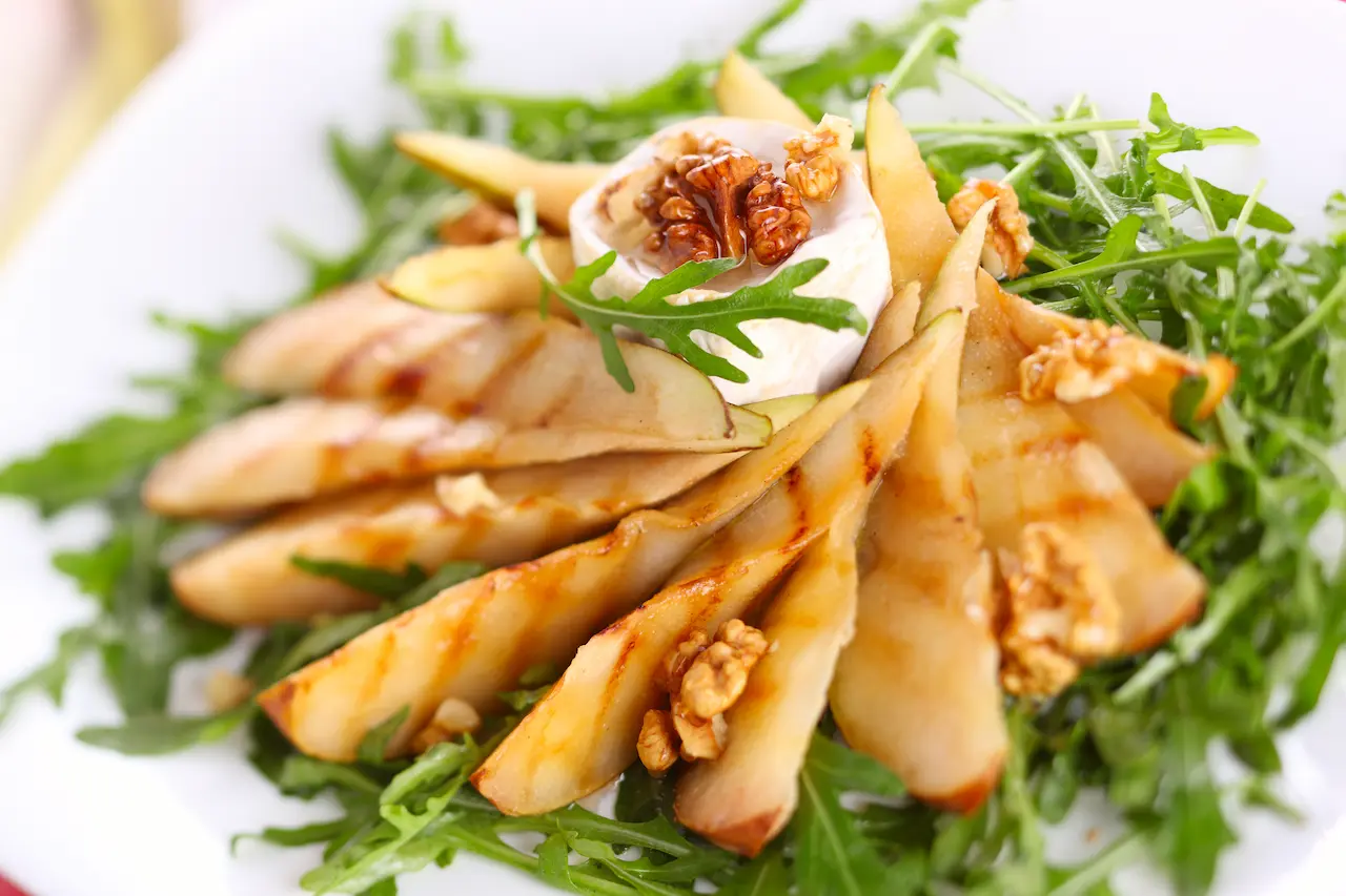 White Plate Filled with Roasted Pear and Rocket Salad