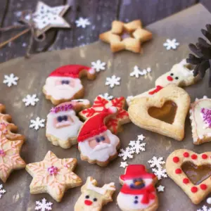 Royal Icing Decorated Christmas Cookies on Wooden Background