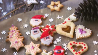 Royal Icing Decorated Christmas Cookies on Wooden Background