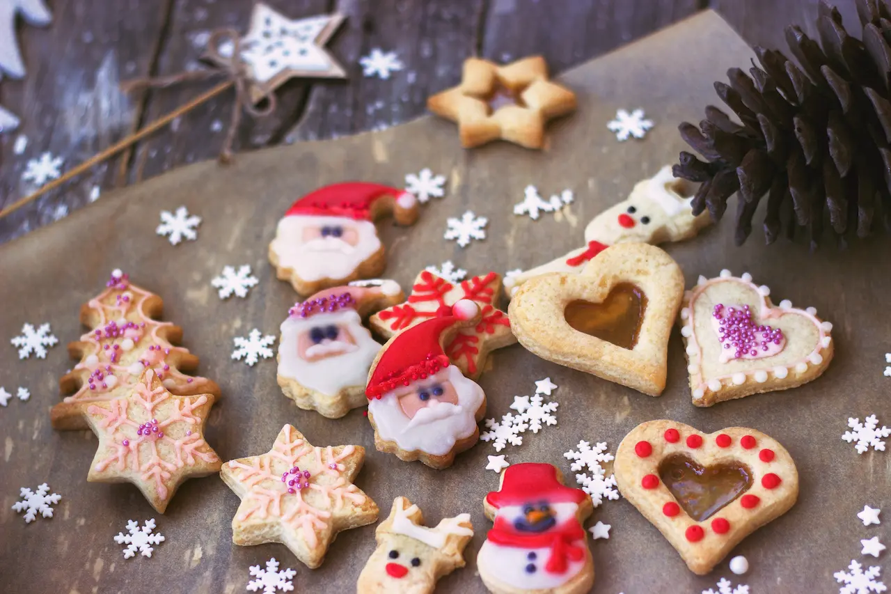 Royal Icing Decorated Christmas Cookies on Wooden Background
