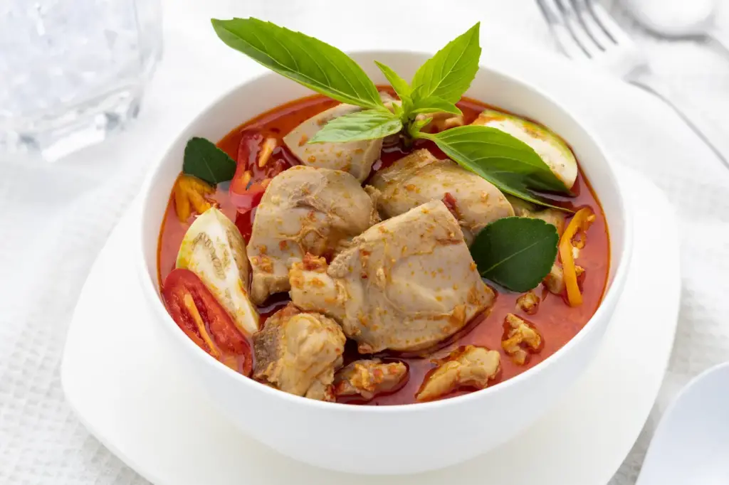 Thai Red Curry Chicken on a White Bowl 