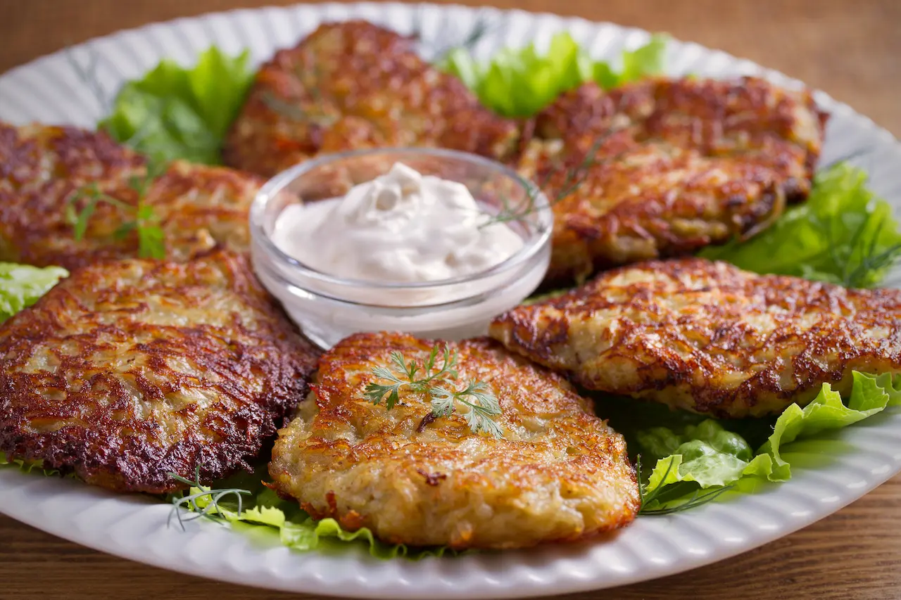 Zucchini & Sweet Potato Fritters on a White Plate