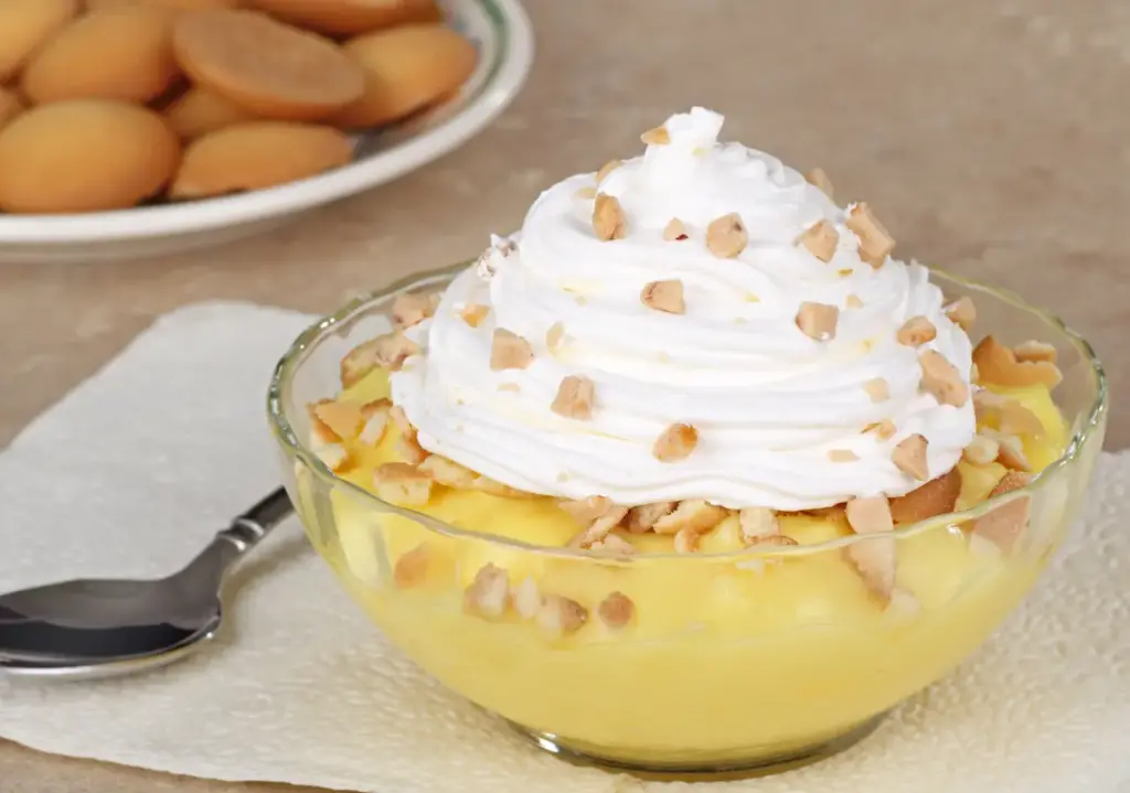 Lemon Pudding Dessert Topped With Whipped Cream