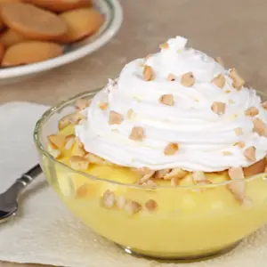 Lemon Pudding Dessert Topped With Whipped Cream