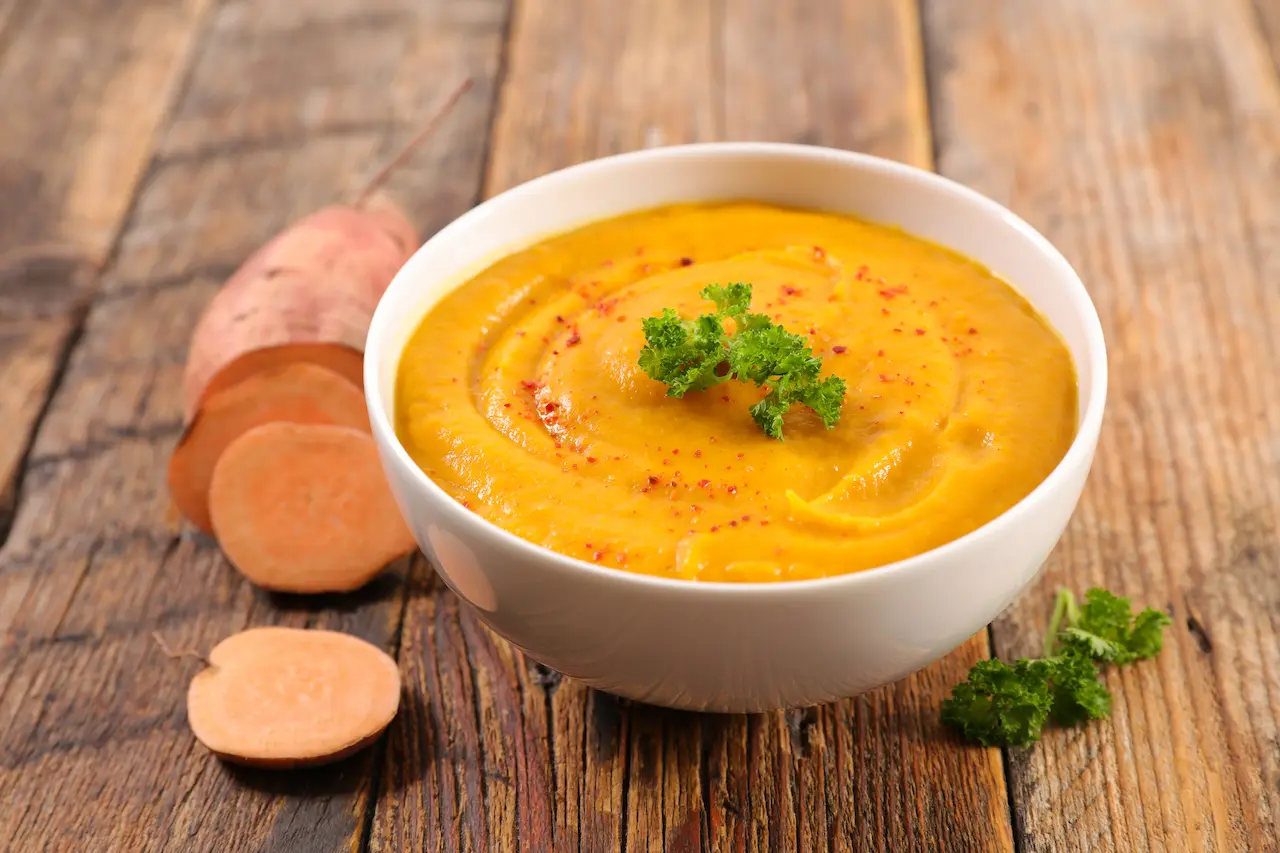 Moroccan Pear and Sweet Potato Soup on a Wooden Table